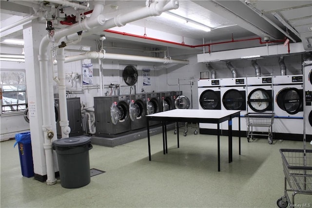 community laundry room with washer and clothes dryer
