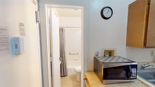 206 W 121st St Unit C, New York Manhattan, NY 10027 - bathroom featuring toilet, a sink, tile patterned flooring, and shower / tub combo with curtain