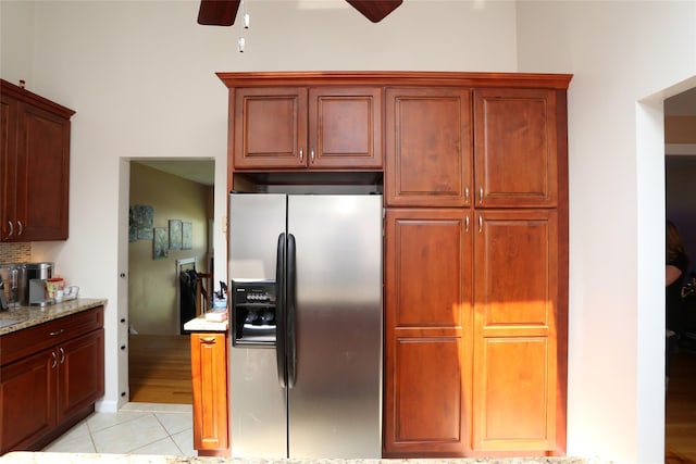 4 Rosemont Dr, New City, NY 10956 - kitchen featuring stainless steel fridge, a ceiling fan, light tile patterned floors, and light stone countertops