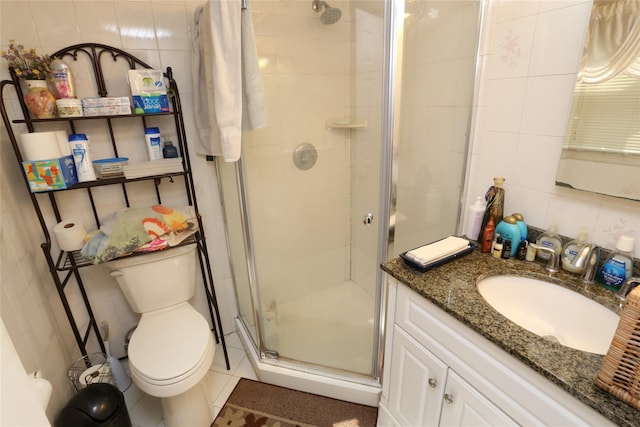 4 Rosemont Dr, New City, NY 10956 - bathroom with tile walls, a stall shower, vanity, and toilet