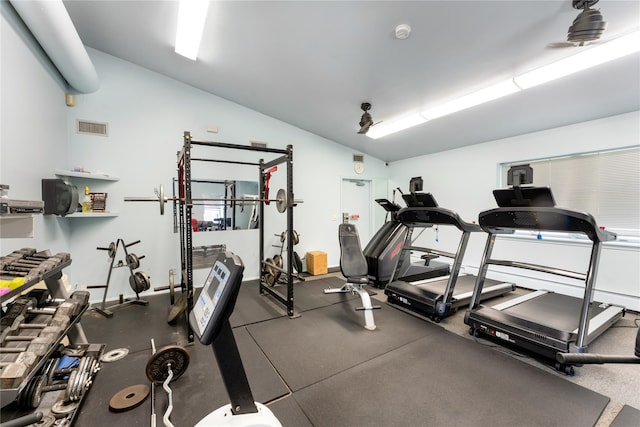 workout area with vaulted ceiling