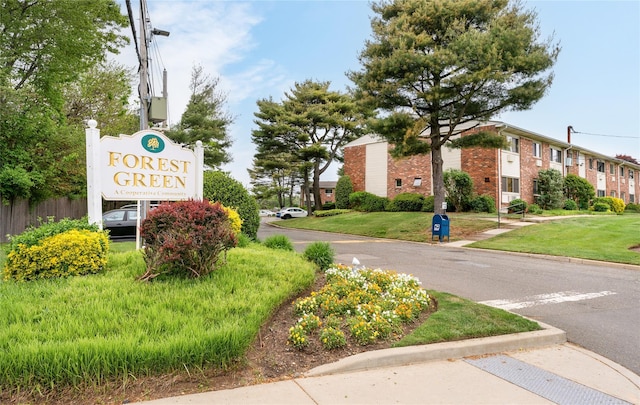 view of home's community featuring a lawn