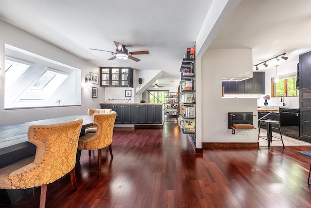 3 Hilltop Rd, Poughkeepsie, NY 12601 - dining area with dark wood-type flooring, a ceiling fan, rail lighting, and baseboards