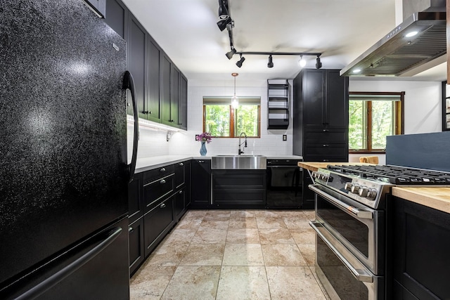3 Hilltop Rd, Poughkeepsie, NY 12601 - kitchen with freestanding refrigerator, wall chimney range hood, range with two ovens, a sink, and decorative backsplash