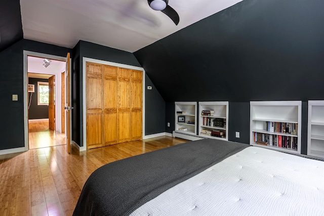 3 Hilltop Rd, Poughkeepsie, NY 12601 - bedroom featuring lofted ceiling, wood finished floors, baseboards, a closet, and a baseboard heating unit