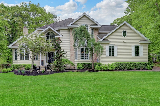 12 Mill River Rd, Setauket, NY 11733 - traditional-style house featuring a front yard, a chimney, and roof with shingles