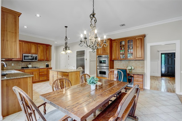 12 Mill River Rd, Setauket, NY 11733 - dining space featuring light tile patterned flooring, crown molding, a chandelier, and recessed lighting