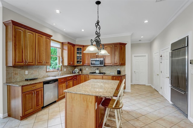 12 Mill River Rd, Setauket, NY 11733 - kitchen with appliances with stainless steel finishes, a sink, light stone counters, decorative backsplash, and light tile patterned floors