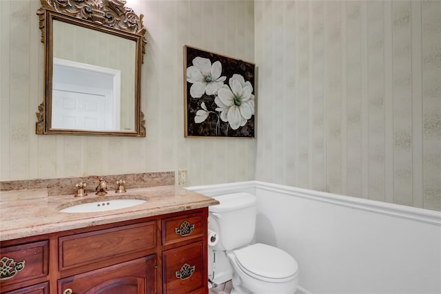 12 Mill River Rd, Setauket, NY 11733 - half bath with vanity, toilet, and wallpapered walls