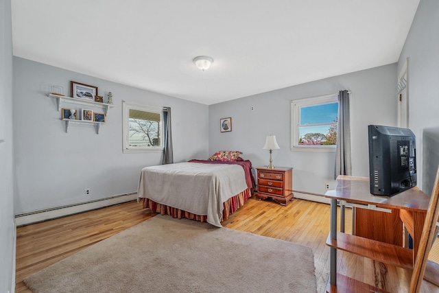 146 Awixa Ave, Bay Shore, NY 11706 - bedroom with baseboard heating and wood finished floors