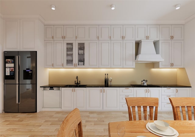 146 Awixa Ave, Bay Shore, NY 11706 - kitchen with stainless steel refrigerator with ice dispenser, premium range hood, white cabinets, and recessed lighting