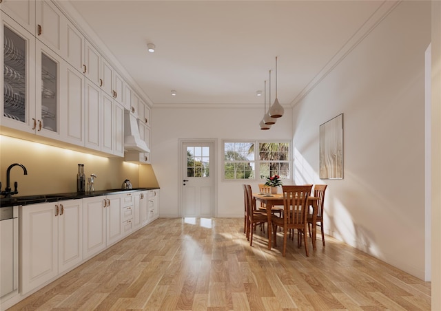 146 Awixa Ave, Bay Shore, NY 11706 - dining space featuring light wood-type flooring and ornamental molding