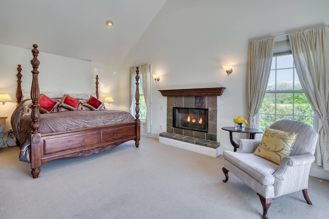 46 Oak St, Westhampton Beach, NY 11978 - bedroom with carpet floors, multiple windows, a fireplace, and high vaulted ceiling