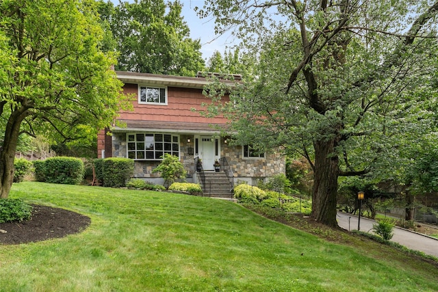 50 Burnside Dr, Hastings-On-Hudson, NY 10706 - view of front facade with stone siding and a front yard