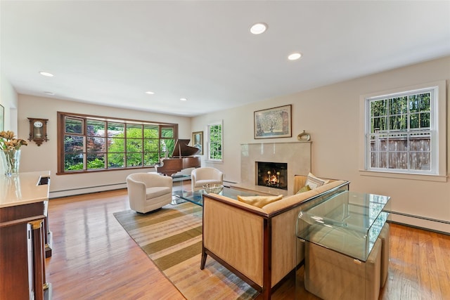 50 Burnside Dr, Hastings-On-Hudson, NY 10706 - living room featuring baseboard heating, light wood finished floors, a fireplace, recessed lighting, and a baseboard heating unit