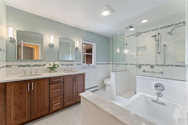50 Burnside Dr, Hastings-On-Hudson, NY 10706 - full bathroom with a stall shower, tile patterned floors, a bath, double vanity, and a baseboard heating unit