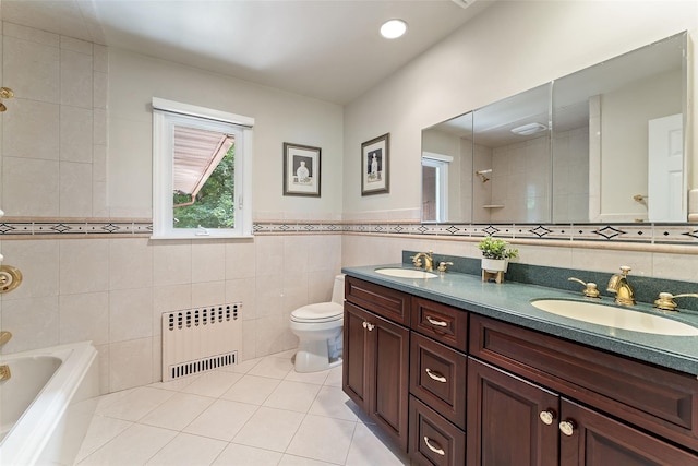 50 Burnside Dr, Hastings-On-Hudson, NY 10706 - bathroom featuring radiator, tile walls, tile patterned flooring, double vanity, and a tub to relax in