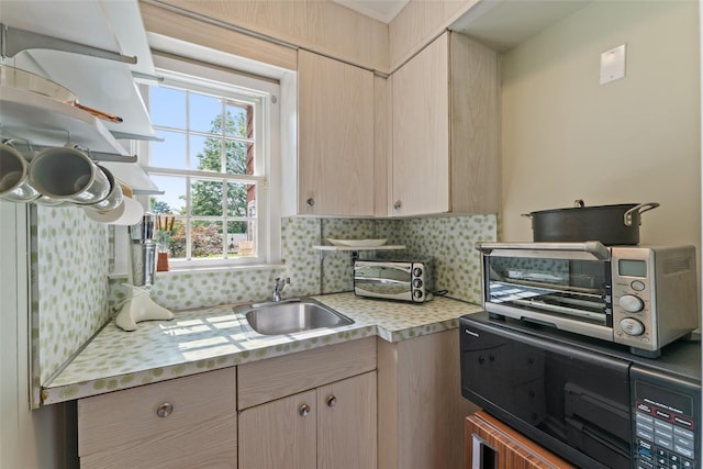 50 Burnside Dr, Hastings-On-Hudson, NY 10706 - kitchen featuring light countertops, backsplash, and light brown cabinets