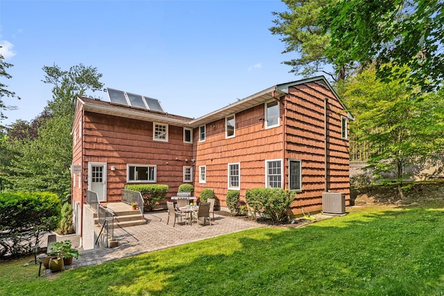 50 Burnside Dr, Hastings-On-Hudson, NY 10706 - back of house featuring a patio area and solar panels