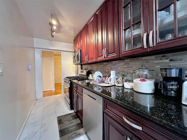 270 N Broadway Unit 2Hi, Yonkers, NY 10701 - kitchen with appliances with stainless steel finishes, light marble finish flooring, reddish brown cabinets, and tasteful backsplash