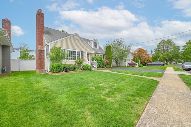 1652 Baker Ave, Merrick, NY 11566 - view of front of property with a shingled roof and a chimney