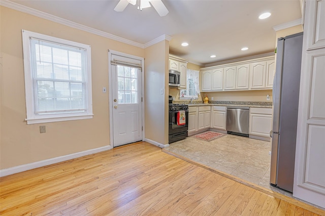 1652 Baker Ave, Merrick, NY 11566 - kitchen featuring appliances with stainless steel finishes, light wood-type flooring, ornamental molding, baseboards, and ceiling fan