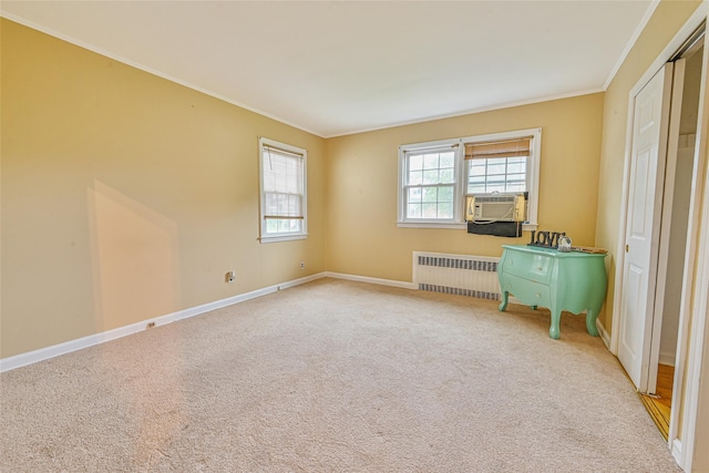 1652 Baker Ave, Merrick, NY 11566 - unfurnished bedroom with radiator, crown molding, carpet flooring, and baseboards