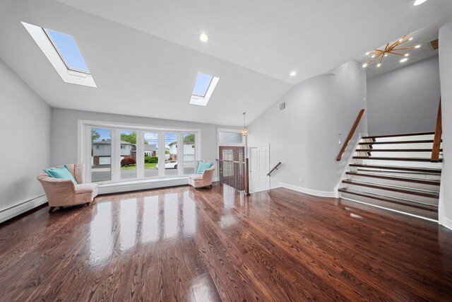 3161 Grand Ave, Baldwin Harbor, NY 11510 - living area with a skylight, vaulted ceiling, wood finished floors, stairway, and baseboards