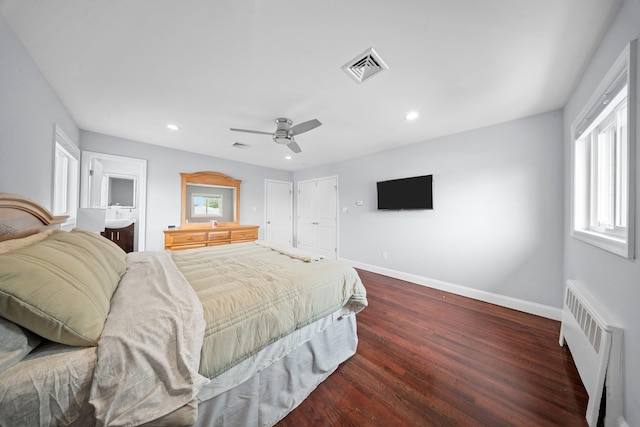 3161 Grand Ave, Baldwin Harbor, NY 11510 - bedroom featuring radiator heating unit, dark wood finished floors, baseboards, recessed lighting, and a ceiling fan