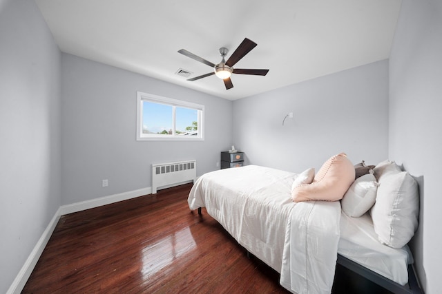 3161 Grand Ave, Baldwin Harbor, NY 11510 - bedroom with radiator, baseboards, wood finished floors, and a ceiling fan