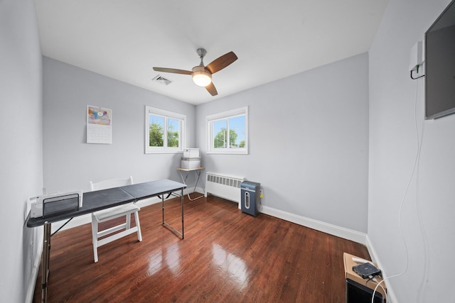 3161 Grand Ave, Baldwin Harbor, NY 11510 - home office with a ceiling fan, radiator, wood finished floors, and baseboards