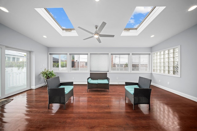 3161 Grand Ave, Baldwin Harbor, NY 11510 - sitting room with a skylight, lofted ceiling, wood finished floors, recessed lighting, and baseboards