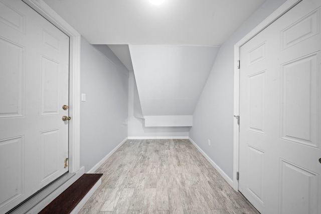 3161 Grand Ave, Baldwin Harbor, NY 11510 - bonus room featuring wood finished floors, baseboards, and lofted ceiling