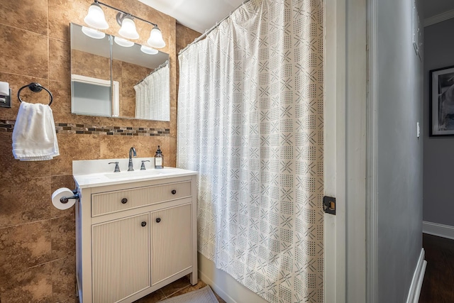101 Old Mamaroneck Rd Unit 1B1, White Plains, NY 10605 - full bath with tile walls, curtained shower, and vanity