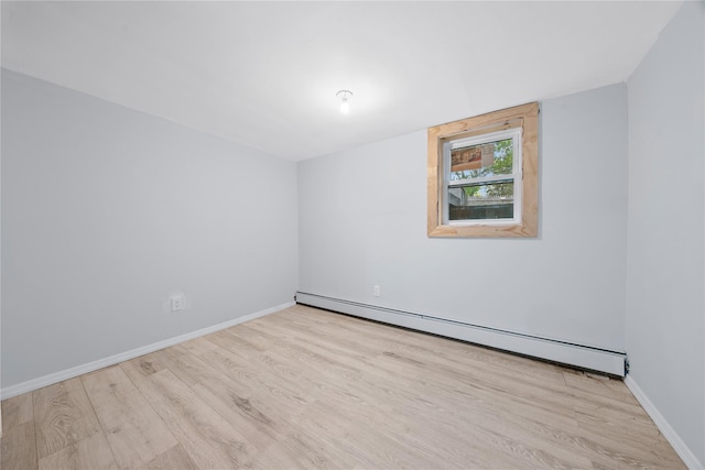 545 Granny Rd, Medford, NY 11763 - unfurnished room with a baseboard heating unit, wood finished floors, and baseboards