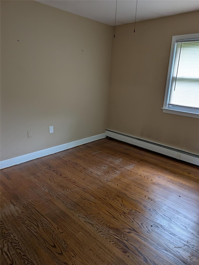 7 Sunset Dr, Yorktown Heights, NY 10598 - empty room featuring dark wood-style flooring, baseboards, and a baseboard radiator