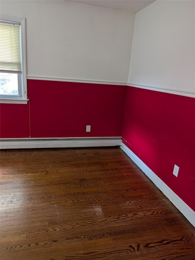 7 Sunset Dr, Yorktown Heights, NY 10598 - spare room featuring a baseboard heating unit and wood finished floors