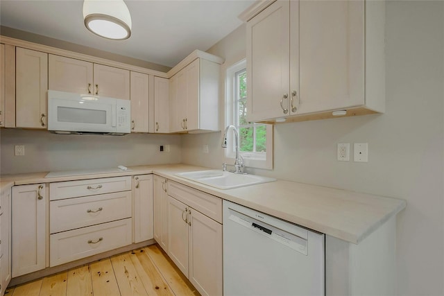 11 The Pkwy, Southampton, NY 11968 - kitchen featuring white appliances, a sink, and light countertops