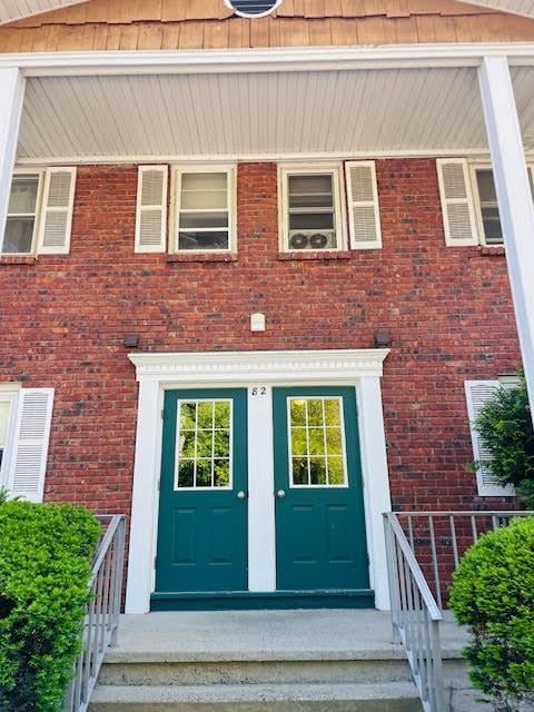 82 Demarest Ave Unit 15, West Nyack, NY 10994 - view of exterior entry with brick siding