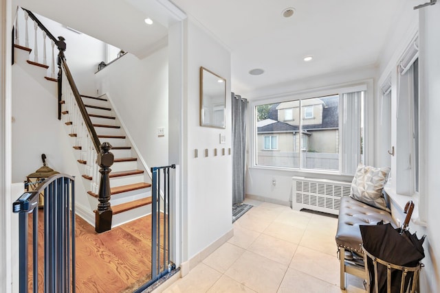 1 3rd Pl, Bellmore, NY 11710 - foyer with radiator, stairway, recessed lighting, crown molding, and baseboards