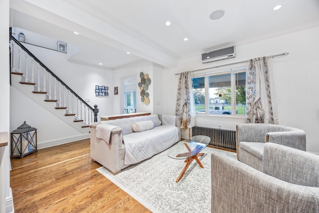 1 3rd Pl, Bellmore, NY 11710 - living area featuring crown molding, an AC wall unit, light wood finished floors, radiator heating unit, and recessed lighting