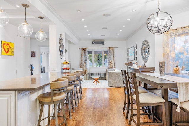 1 3rd Pl, Bellmore, NY 11710 - dining space with radiator, light wood finished floors, a wall mounted air conditioner, crown molding, and recessed lighting