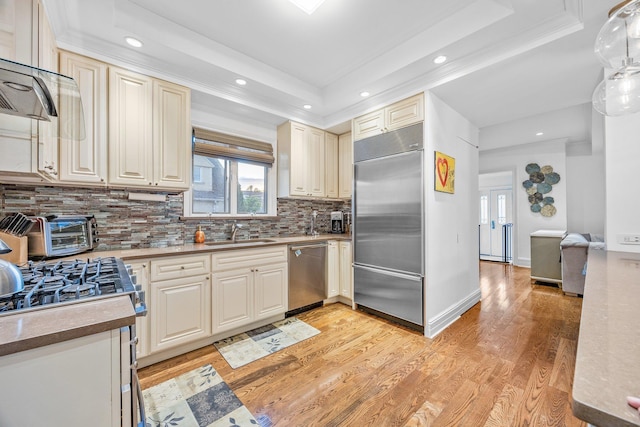 1 3rd Pl, Bellmore, NY 11710 - kitchen featuring stainless steel appliances, a sink, decorative backsplash, recessed lighting, and light wood-style floors