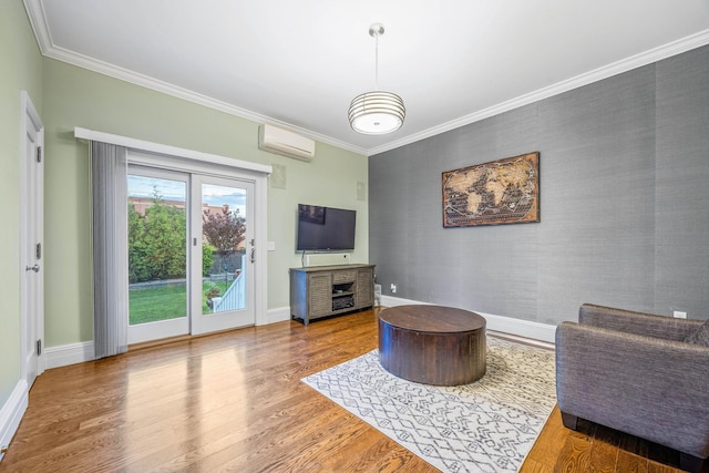 1 3rd Pl, Bellmore, NY 11710 - living area with an AC wall unit, an accent wall, baseboards, wood finished floors, and ornamental molding