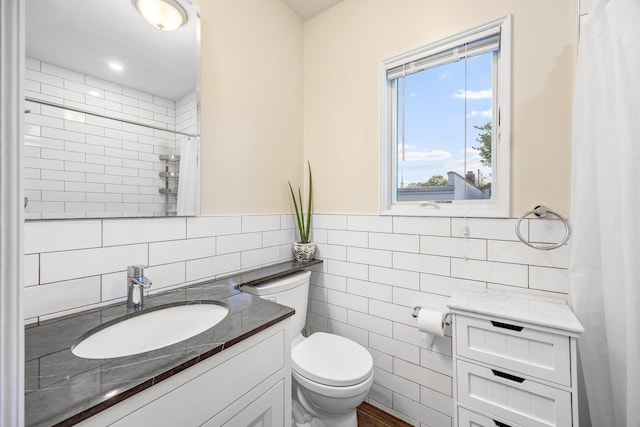 1 3rd Pl, Bellmore, NY 11710 - bathroom featuring tile walls, toilet, a shower with shower curtain, and vanity