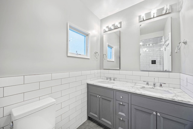 1 3rd Pl, Bellmore, NY 11710 - full bath featuring tile walls, toilet, a shower, double vanity, and wainscoting