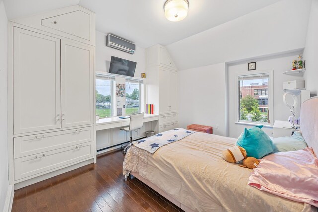 1 3rd Pl, Bellmore, NY 11710 - bedroom with an AC wall unit, vaulted ceiling, and dark wood-style flooring