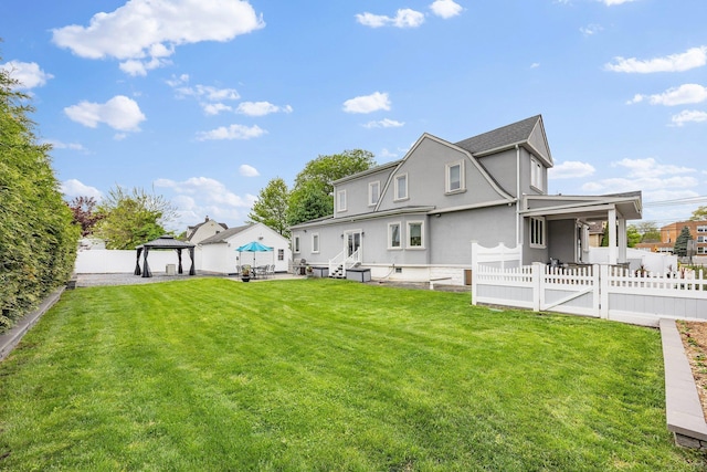 1 3rd Pl, Bellmore, NY 11710 - rear view of property featuring a gazebo and stucco siding