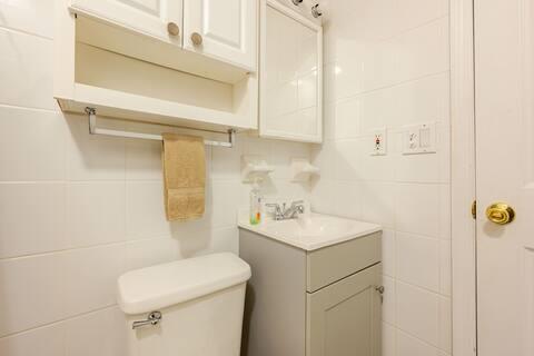 76 Highlands Dr Unit C2, Hunter, NY 12442 - half bathroom featuring vanity and tile walls