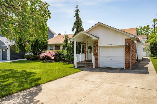 745 Willow Rd, Franklin Square, NY 11010 - view of front facade featuring concrete driveway, brick siding, a garage, and a front yard